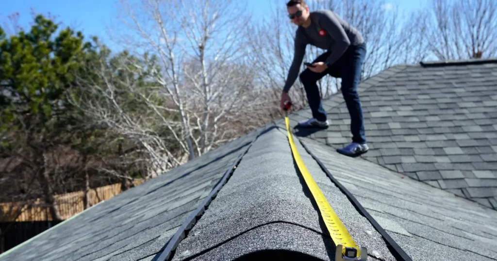 303 roofer measuring a denver roof